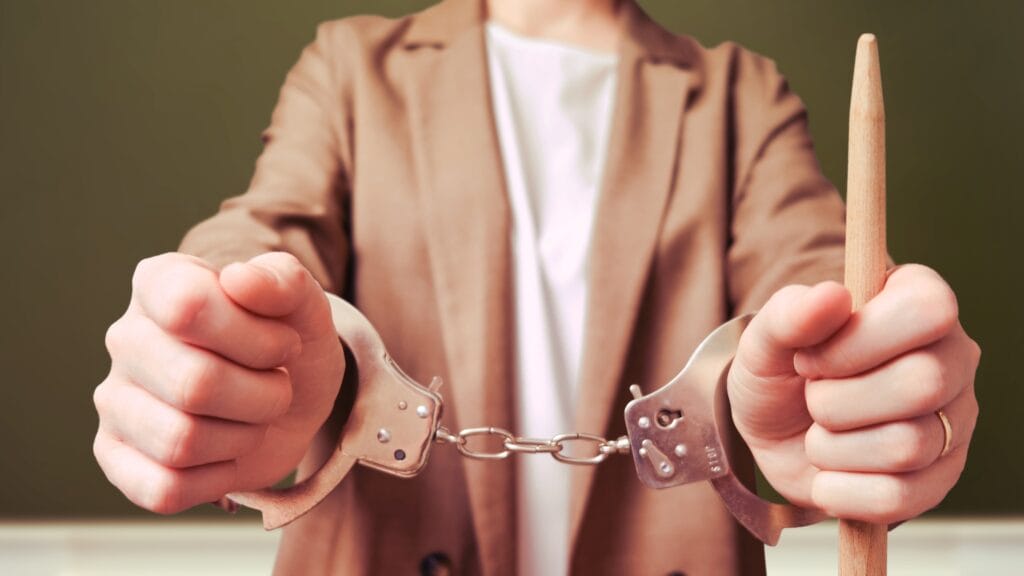 teacher-handcuffs-arrest-prison